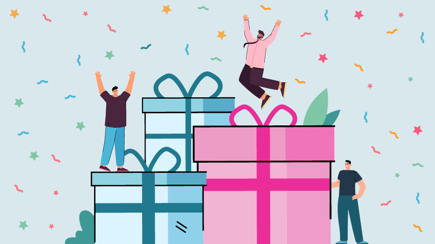 An illustration of three huge gift wrapped presents in Trans Pride Flag colours with three trans men jumping for joy around them, for our article on gifts for trans men