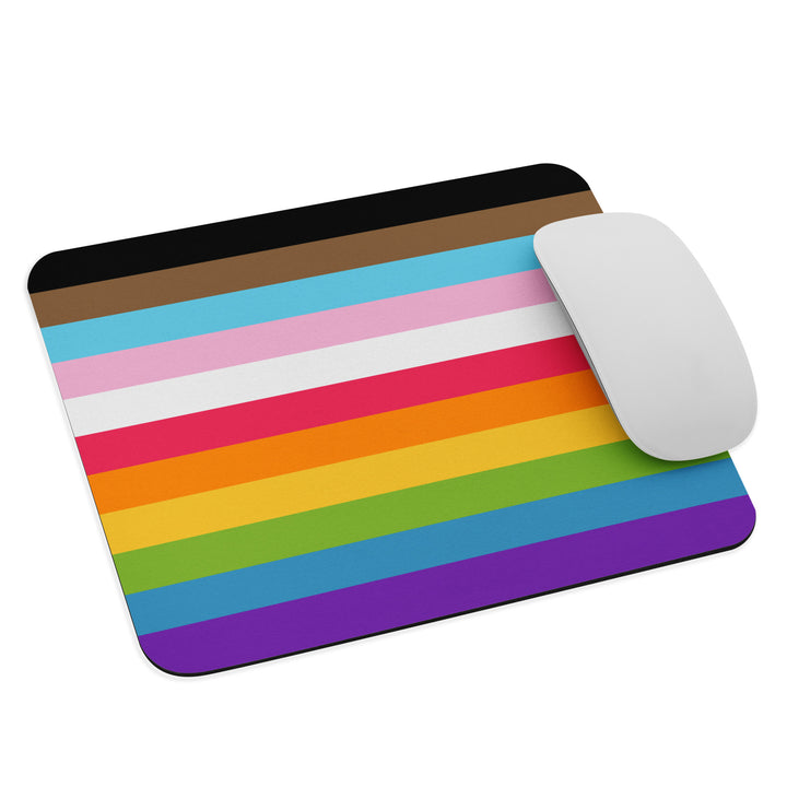 A rectangular mouse pad / mouse mat with the  colours of the Progress Pride Flag as stripes